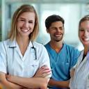 Healthcare professionals interacting positively in a hospital setting.