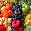 Variety of colorful anti-inflammatory foods like berries, spinach, and nuts